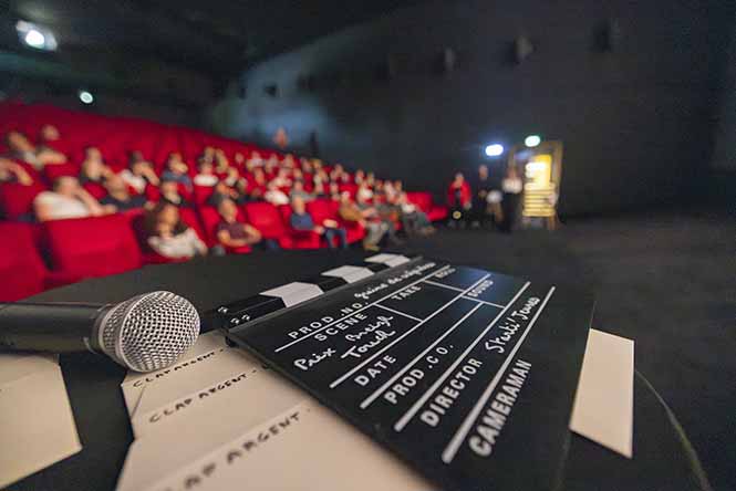 Photo d'un clap de cinéma annonçant un prix gagnant